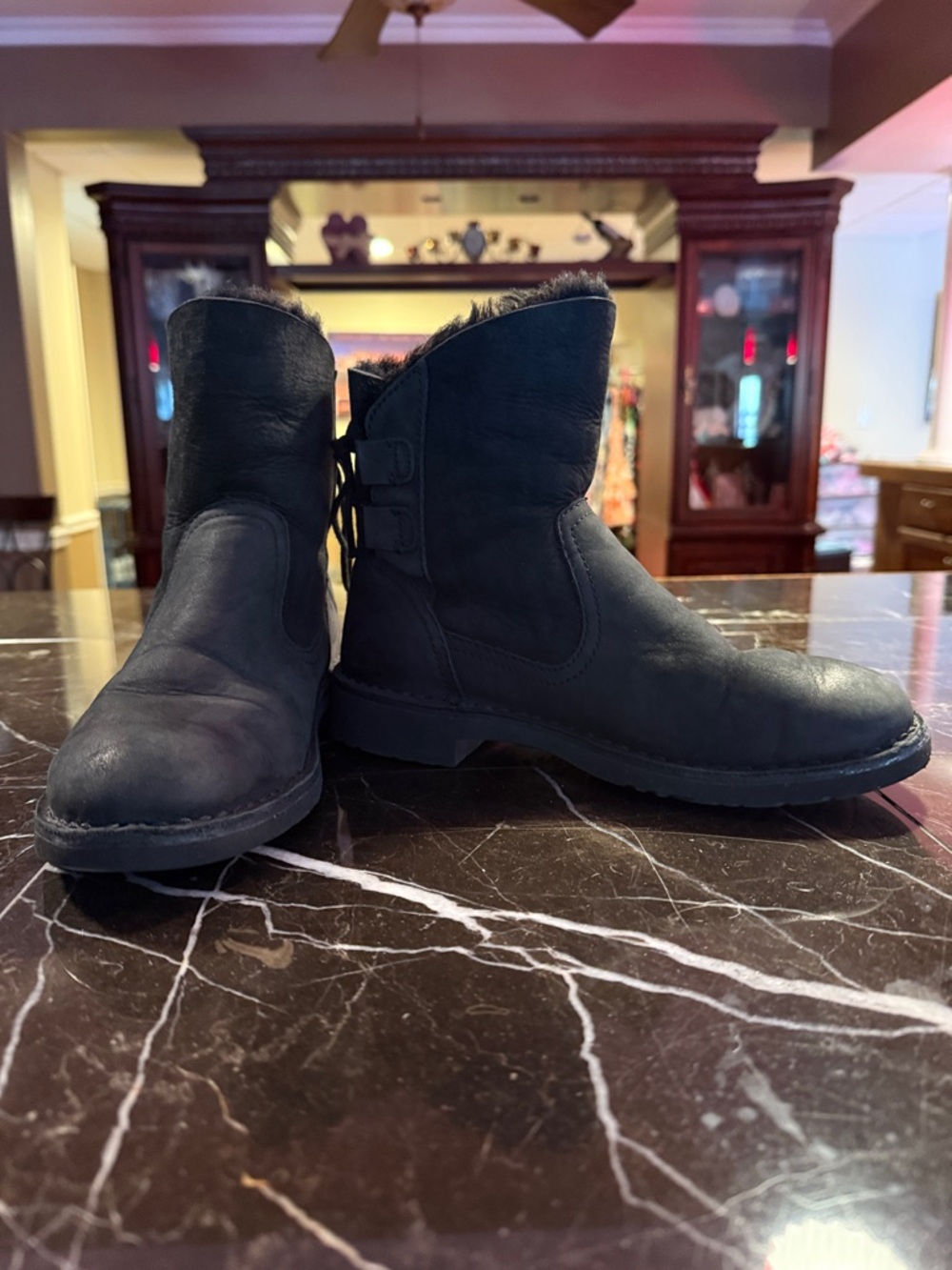 UGG size six lace up back boots with faux fur on the insides